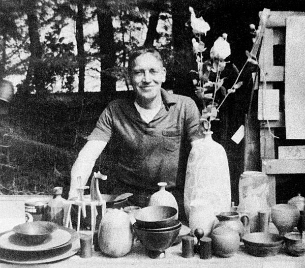 Bill Zacha, with ceramics and Matilija poppies, at the 1966 Mendocino Art Center Fair.