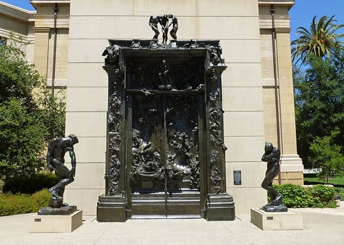 Rodin's Gates of Hell, flanked by the figures of Adam and Eve, at the B. Gerald Cantor Rodin Sculpture Garden, Cantor Arts Center, Stanford University, Palo Alto, California. The Rodin Sculpture Garden is open at all hours, with lighting for nighttime viewing. 