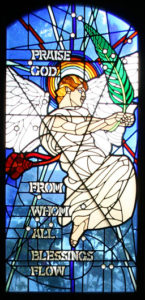 Praise God from Whom all blessings flow, one of the stained glass windows designed by Charles Marchant Stevenson for St. Michael and All Angels Episcopal Church, 201 E. Fir Street, Fort Bragg California.