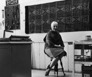 Dorr Bothwell in her studio (1967). Yoruba adire indigo resist cloth on wall. Photo by Bill Foote.