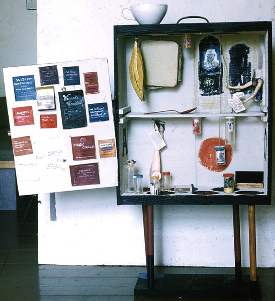 The Alchemist's Valise by Fran Moyer (front, door open), A cabinet assemblage of polychrome wood and found objects (64"), 1963.