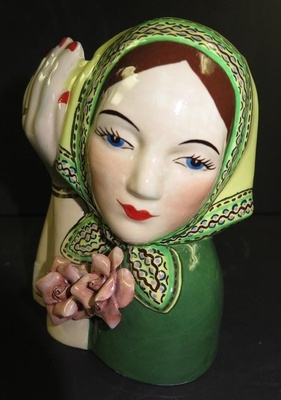 This embellished Gladding, McBean Peasant Head shape (C801), designed by Dorr Bothwell, is not a GMB product, and almost certainly dates from the 1950s or later. Without more information, the creators of these imaginative variants are lost to time, and dates will be approximate.